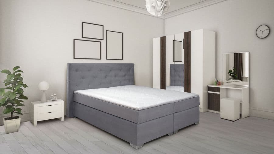 Sivi boxspring krevet u svetloj spavaćoj sobi