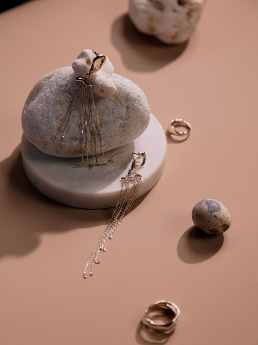 Silver jewellery on a stone
