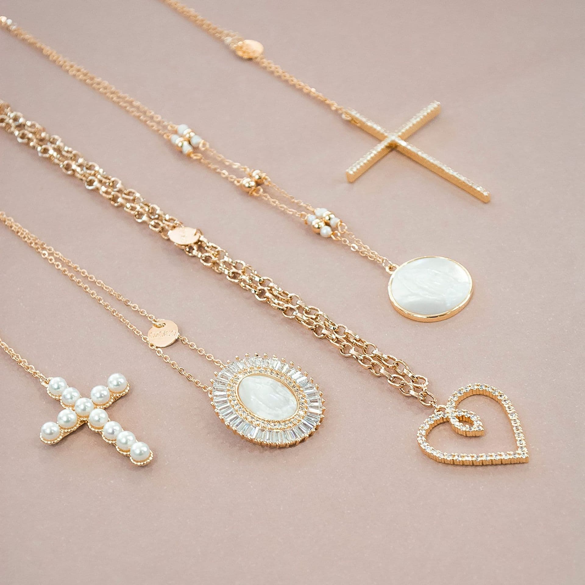 Gold chains with mother-of-pearl and pearl pendants