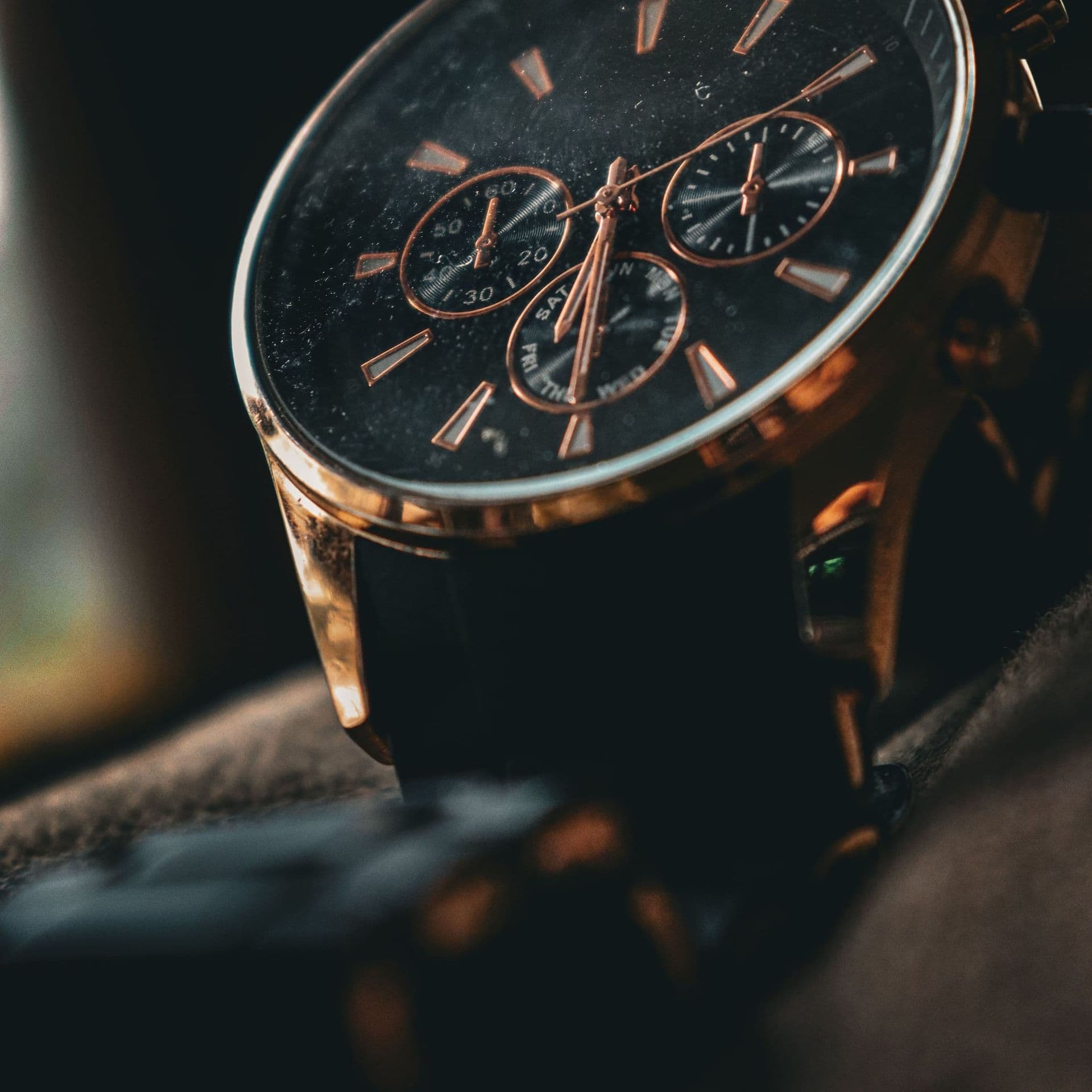 A men's chronograph with a rose gold-tone case