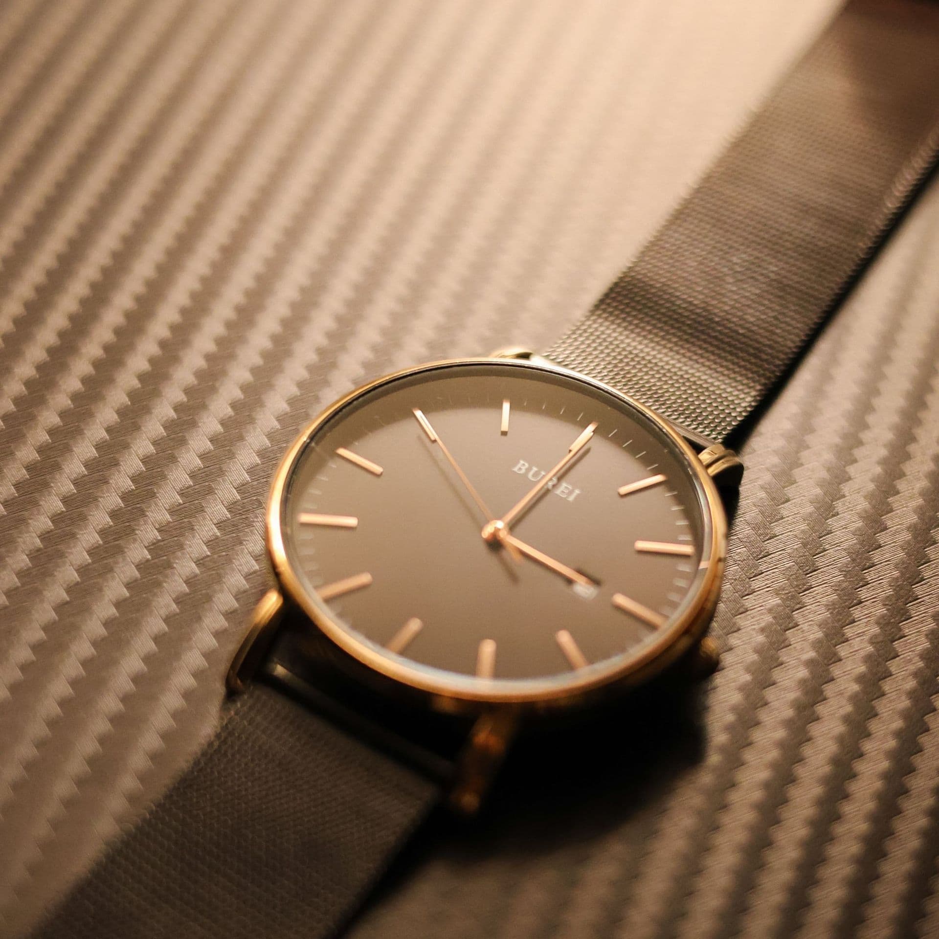 A minimalist watch with a mesh bracelet
