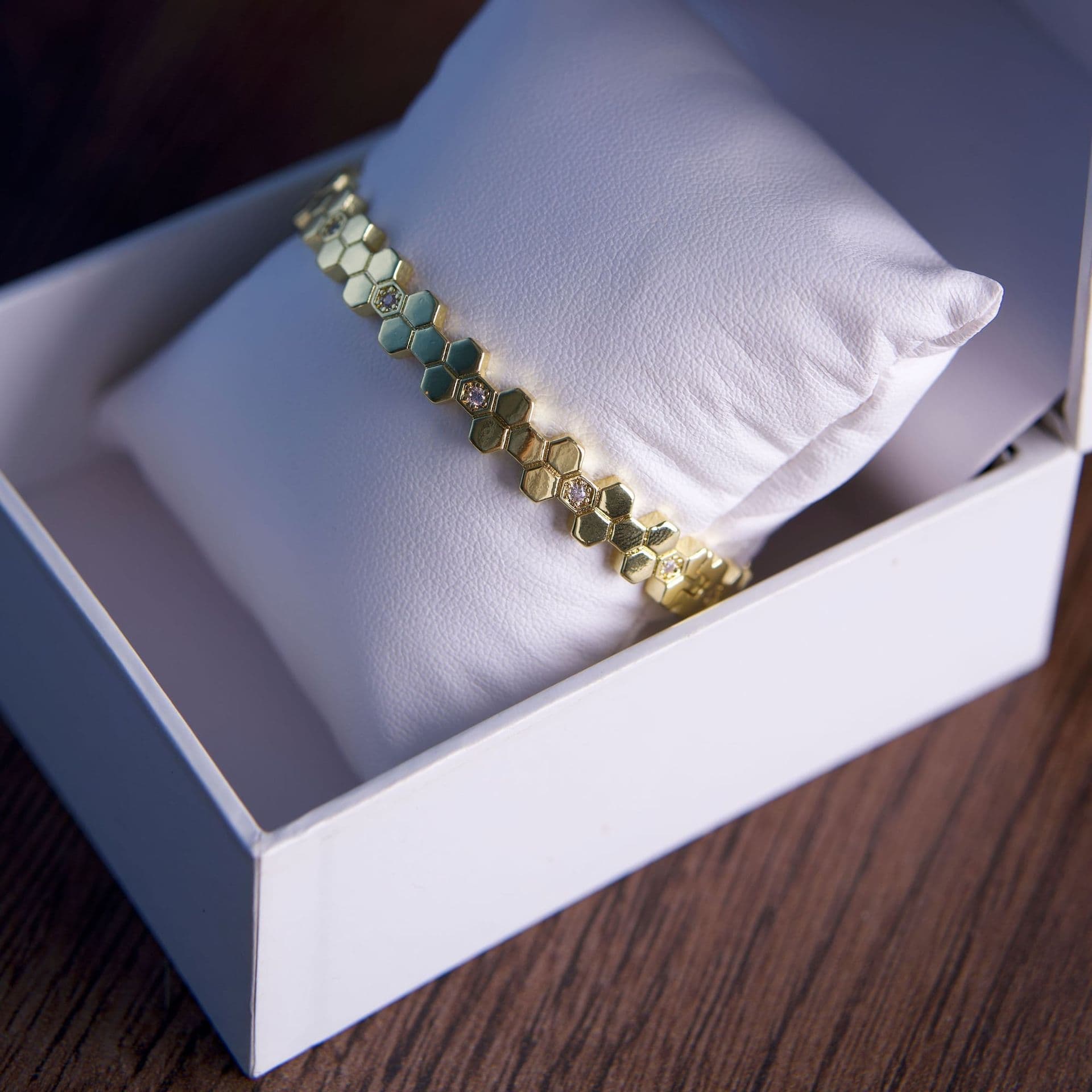 A gold bracelet with hexagonal links