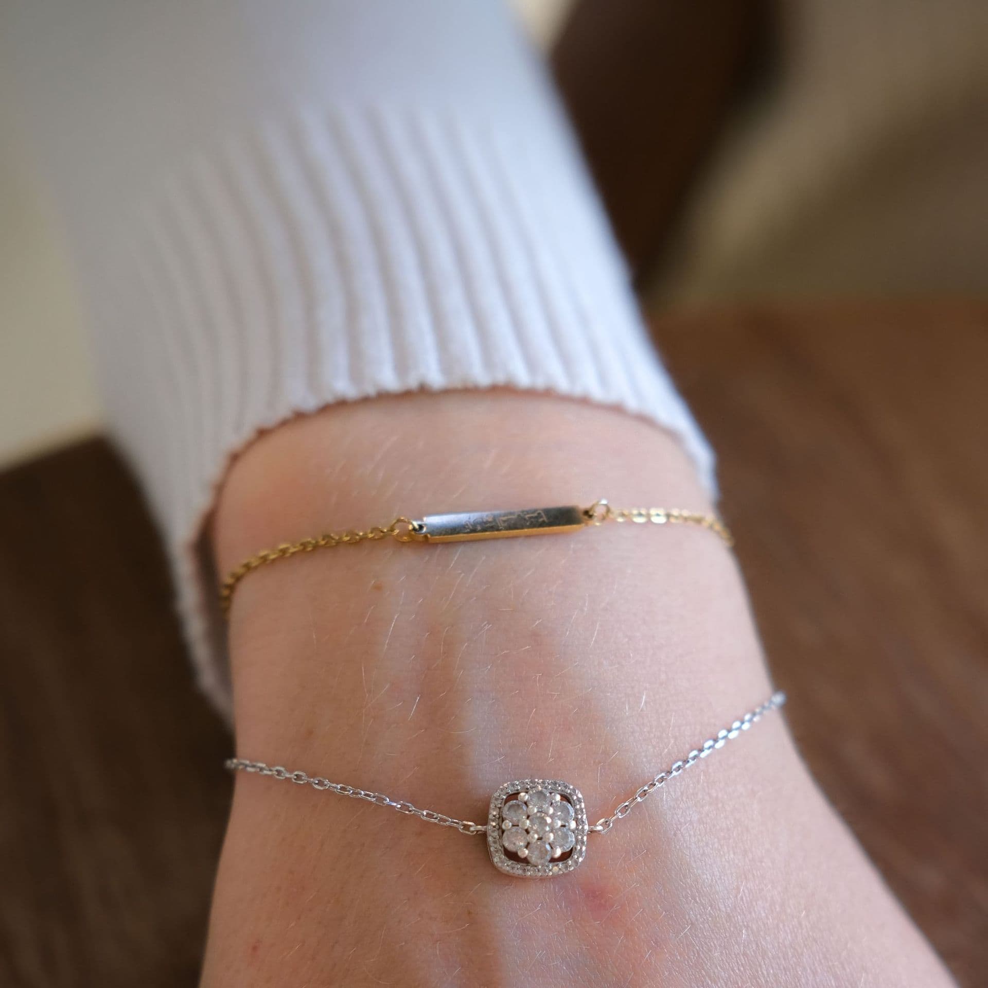 A thin gold bracelet on the wrist